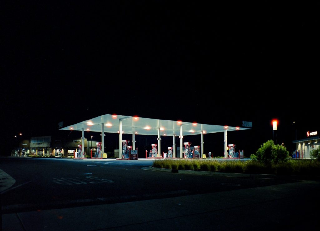 Well-lit gas station on a quiet night