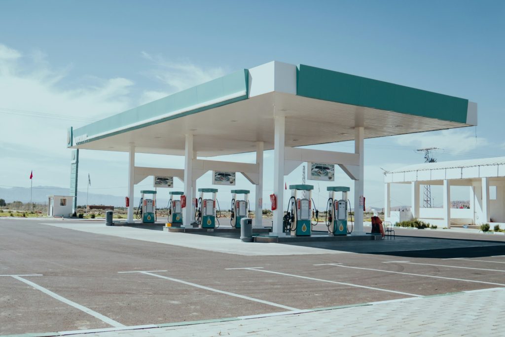 Deserted gas station under clear blue sky