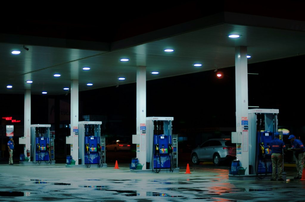 Gas station with multiple pumps at night